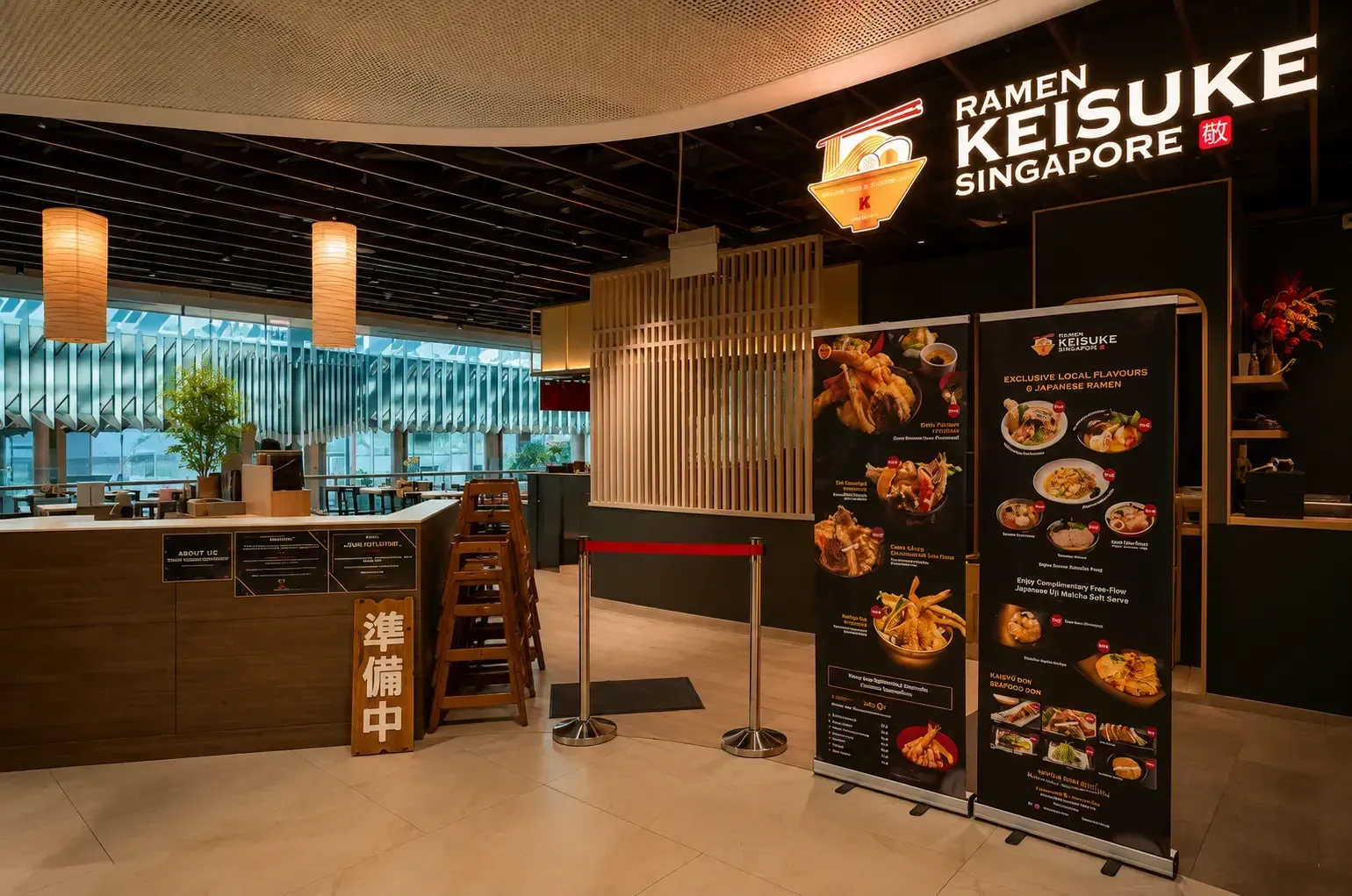 Entrance to Ramen Keisuke Singapore with large menu banners, wooden accents, and hanging paper lanterns.