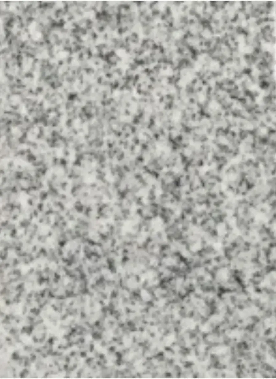 A close up of a gray and white carpet texture.