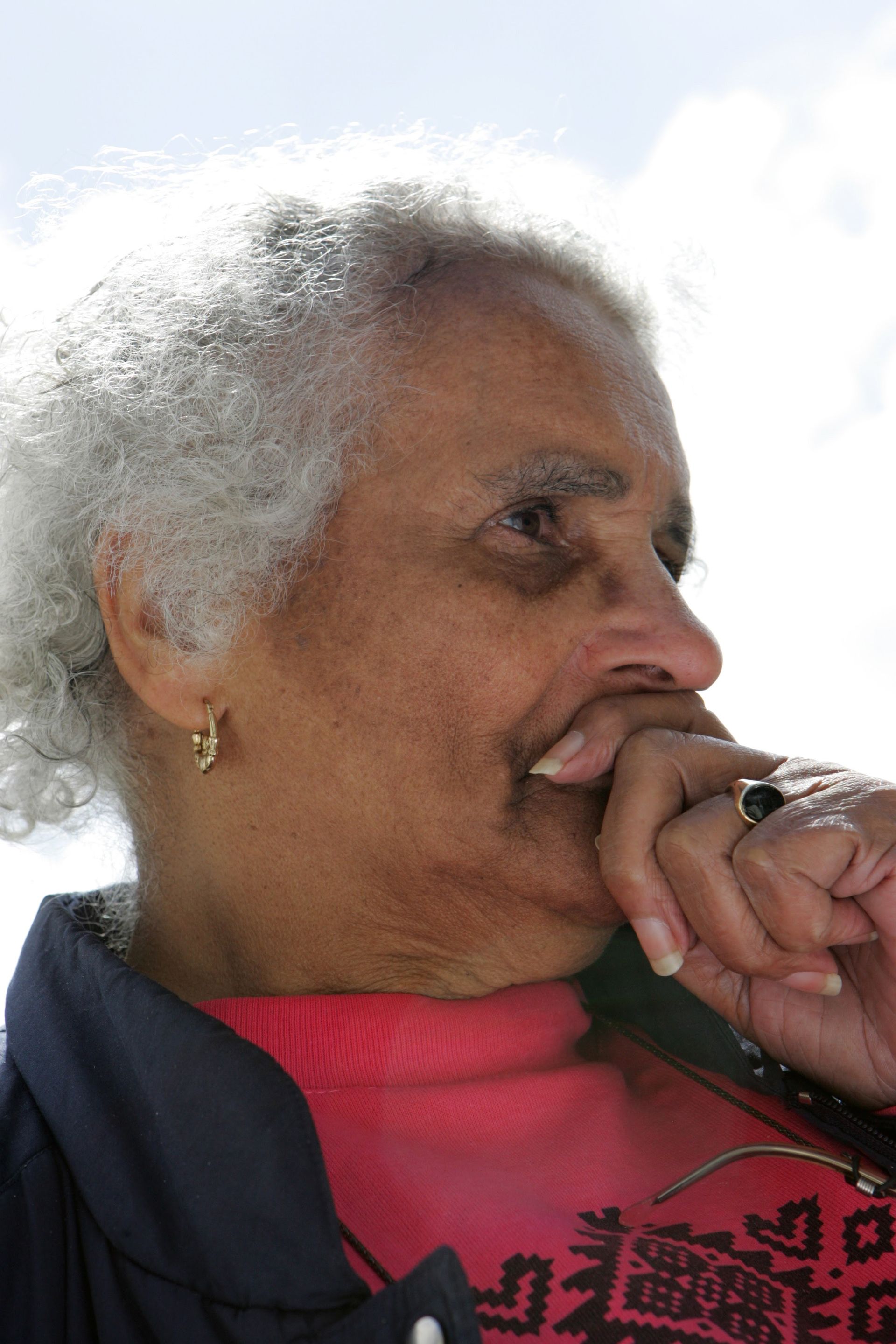 Close-up portrait of Faith Matyszak-Gander in thought.