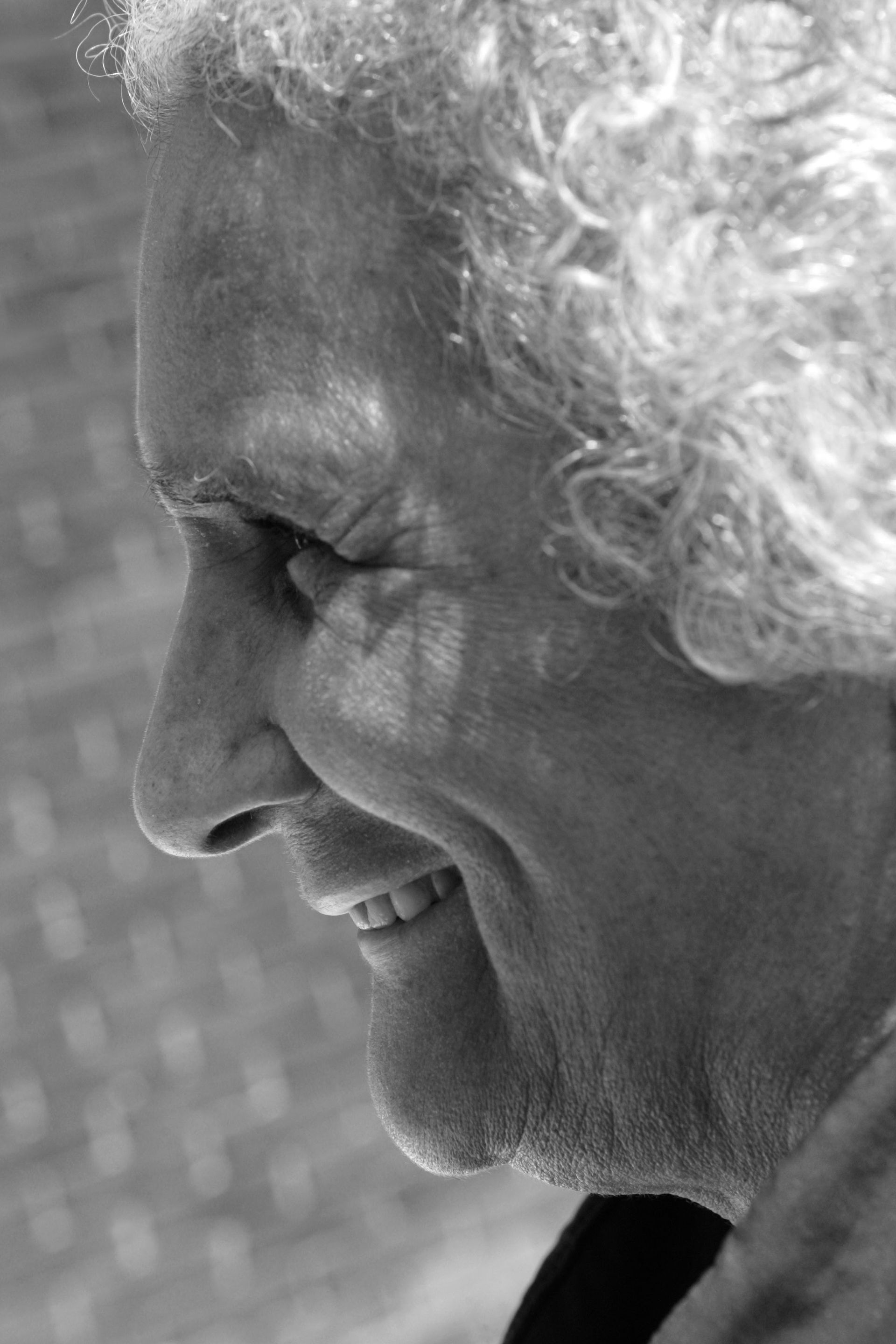 Black and white close-up portrait of Faith Matyszak-Gander smiling.