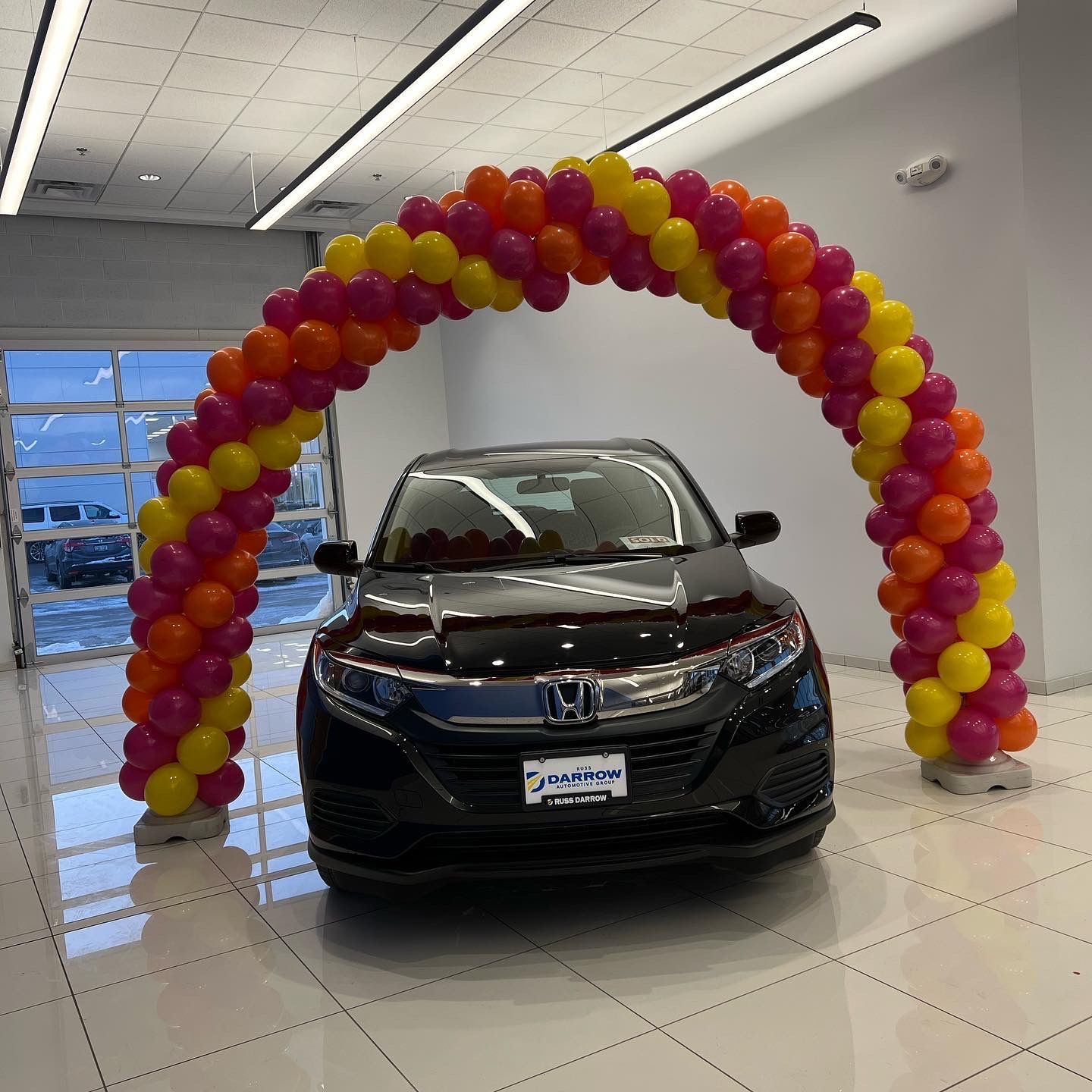 balloon arch over car