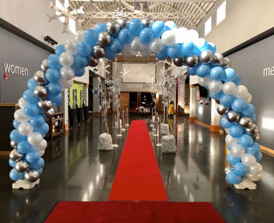 multiple balloon arches of different color