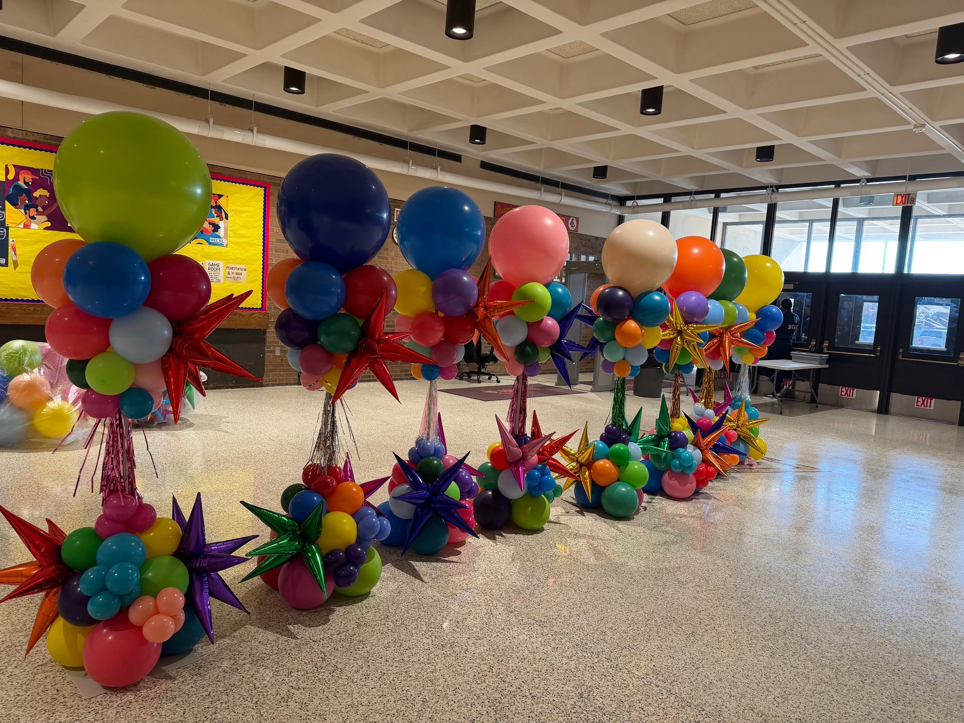 Mickey mouse and minnie mouse made out of balloons