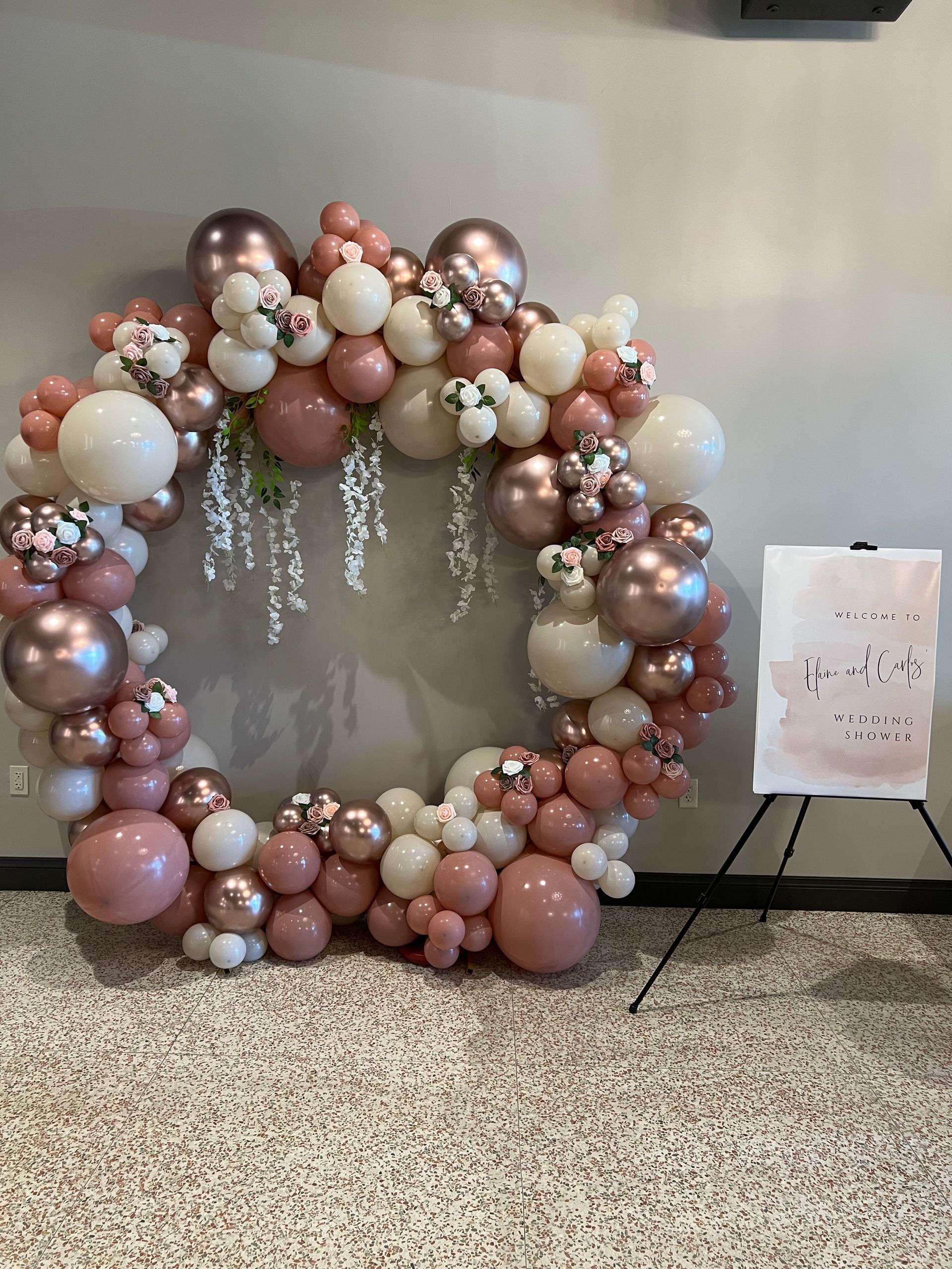A bunch of balloons are sitting on the floor in a room.
