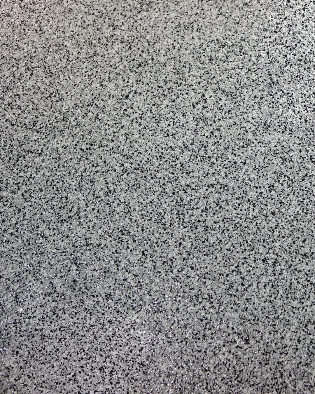 A close up of a gray carpet texture.