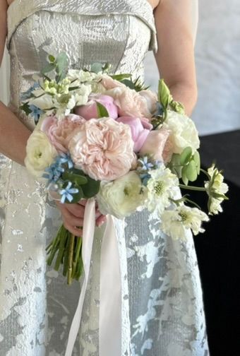 A bridal bouquet designed with pastel flowers