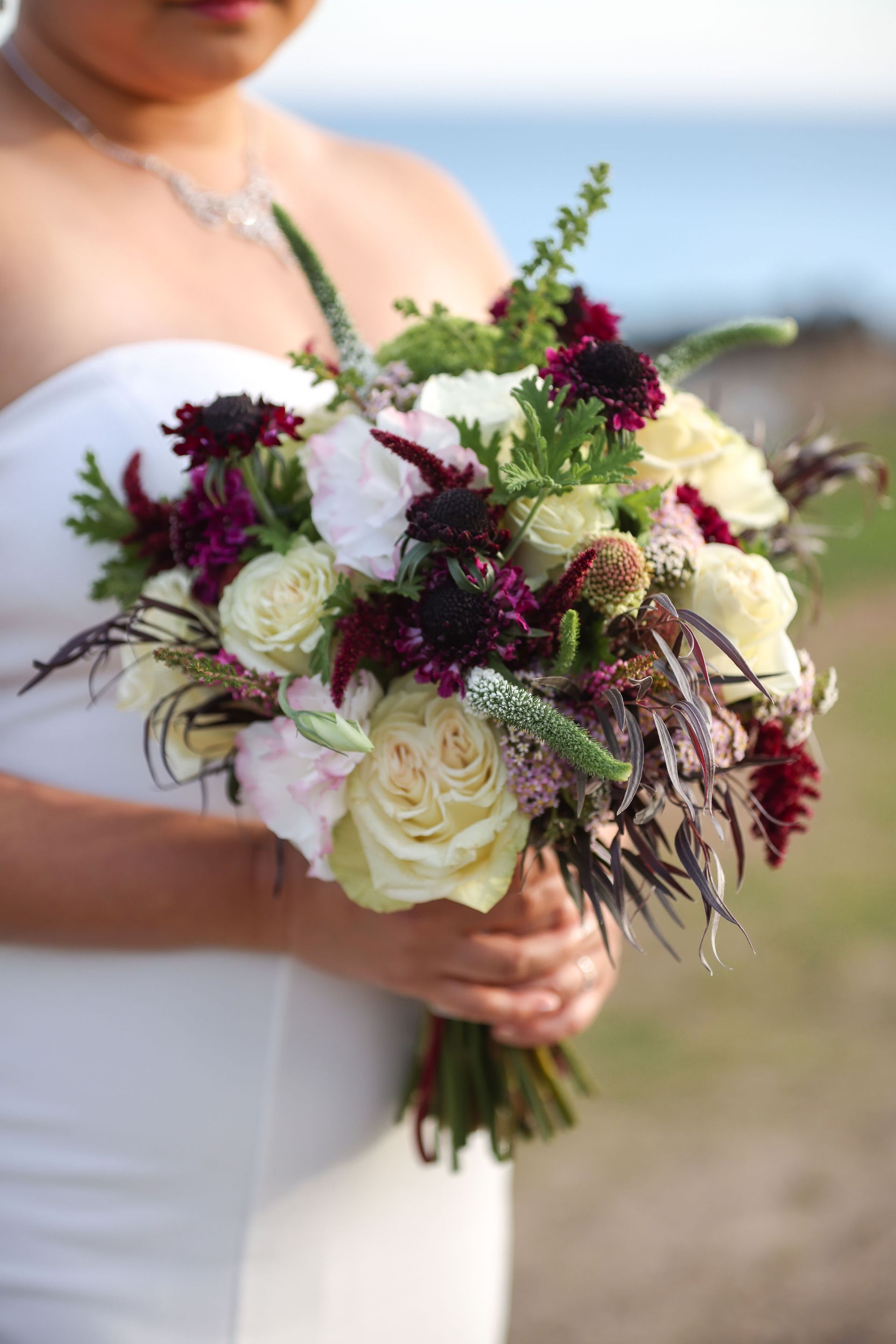 Bridal bouquet in deep purple and white.