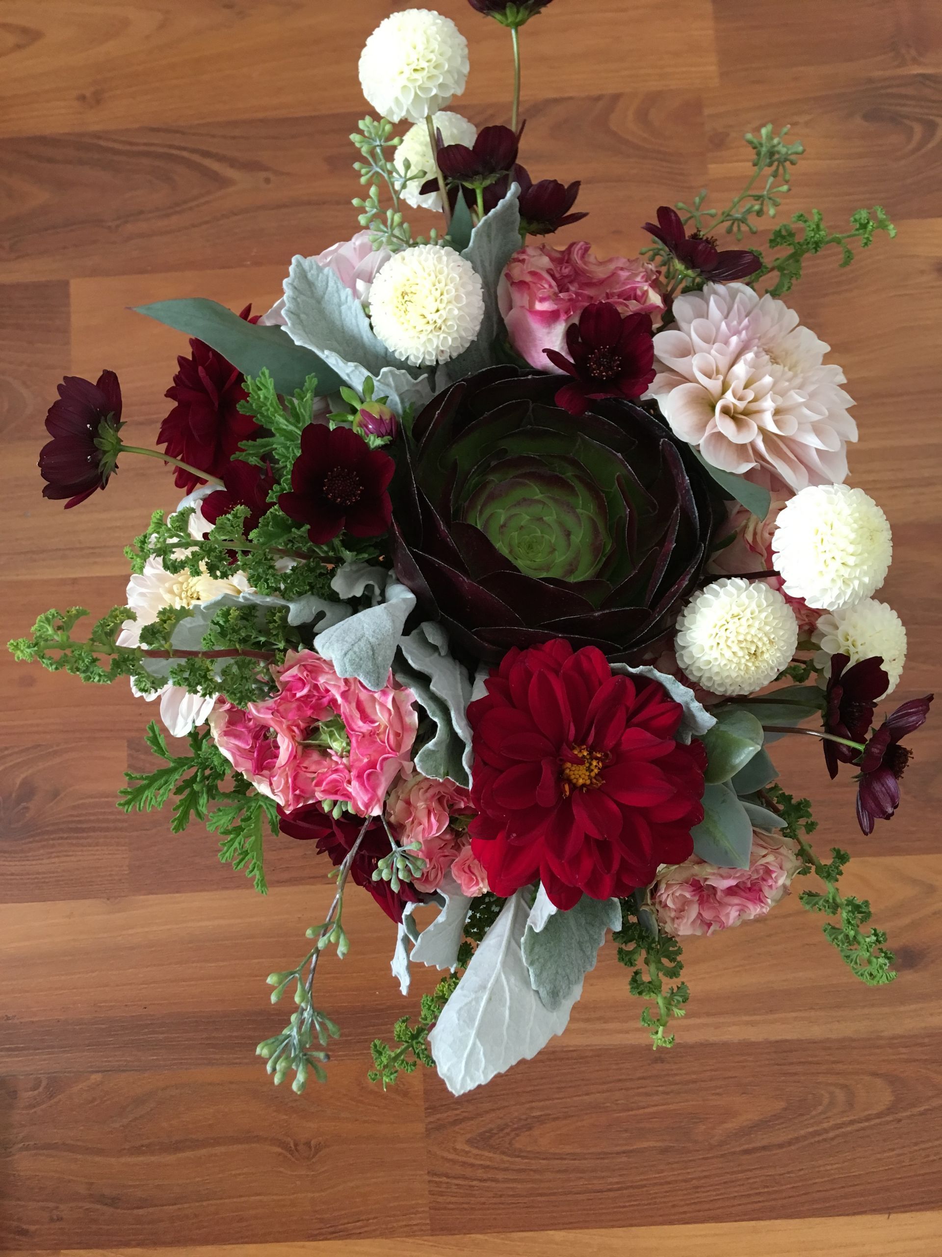Unique and dramatic bridal bouquet with succulents and dahlias.