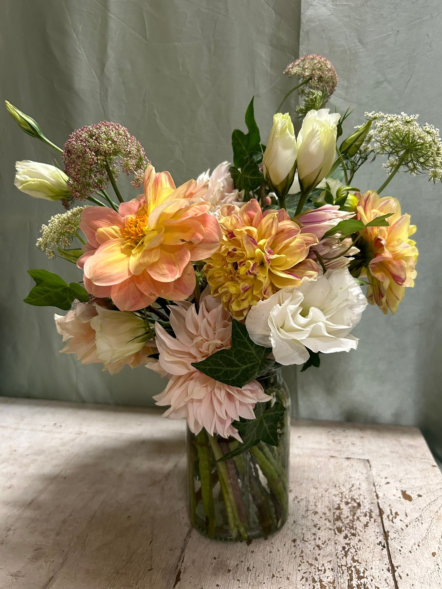 A vase filled with flowers is sitting on a table.