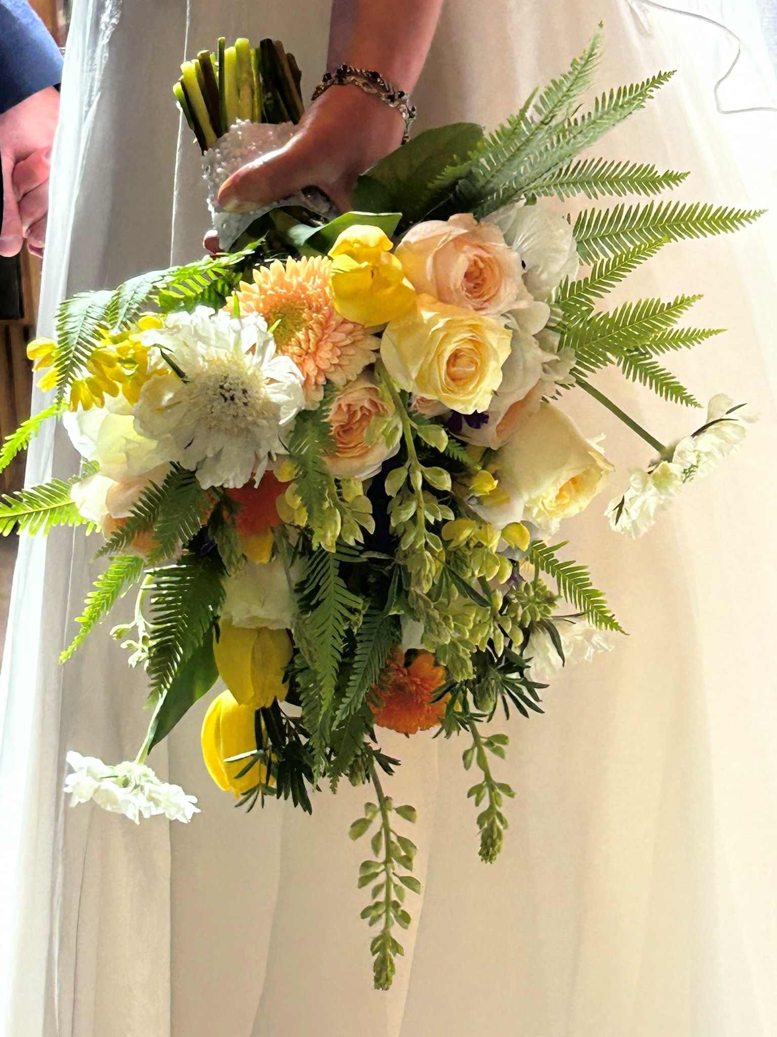 A spring wildflower bouquet of yellow and white