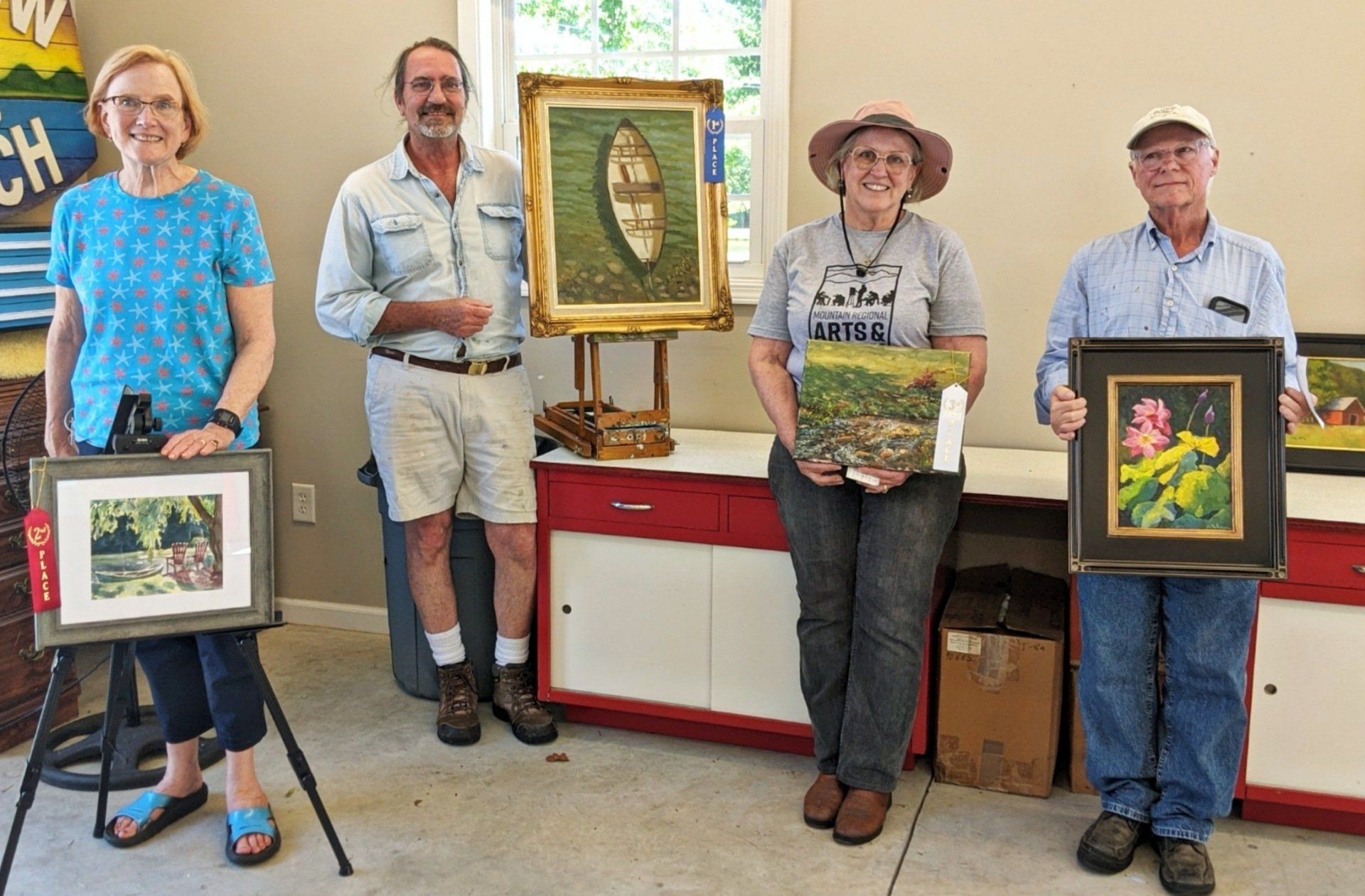 Four artists winners of different awards from the PleinAir Art Festival

