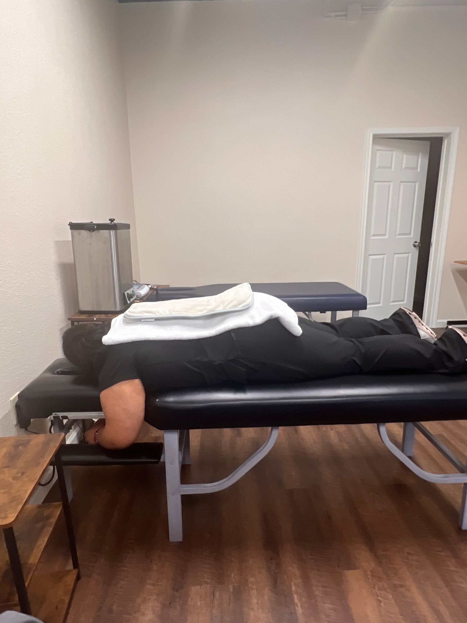a woman is getting a laser treatment on her back .