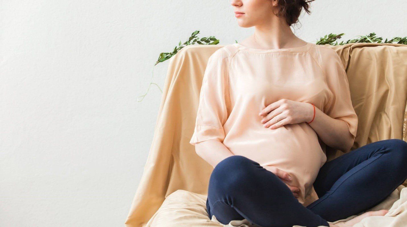 Pregnant Woman Sitting - San Antonio, TX - Adoption Angels