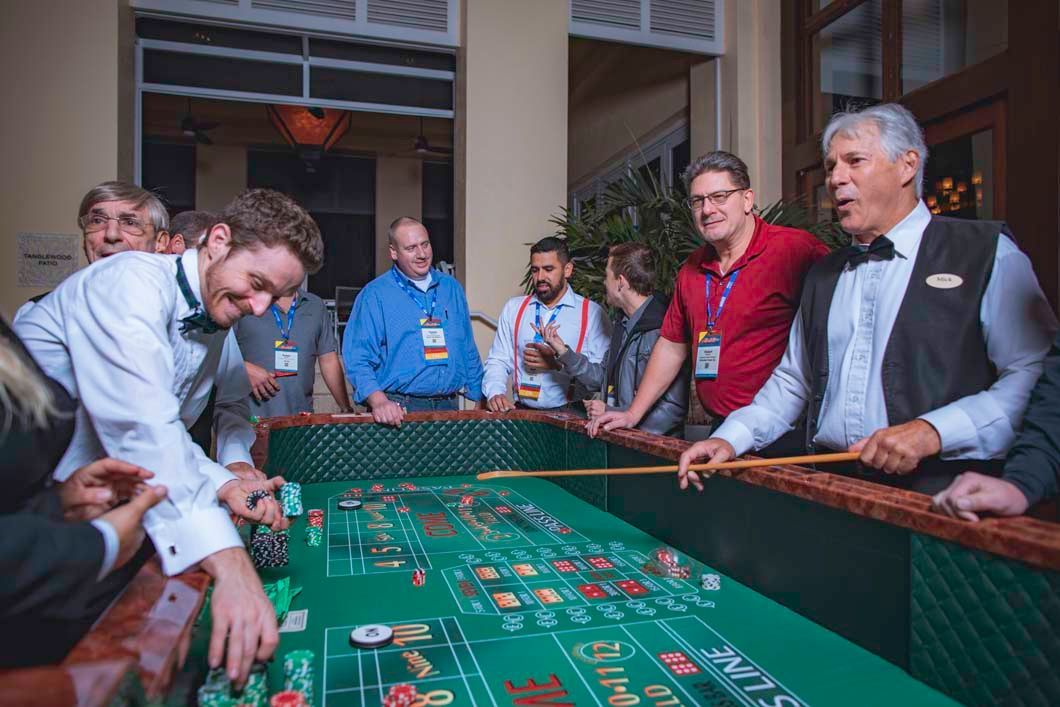 A group of people are playing roulette at a casino table.