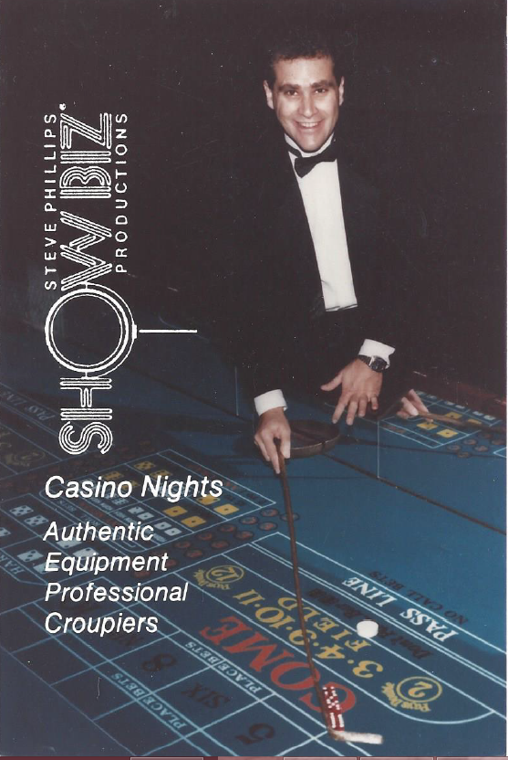 A man in a tuxedo is standing in front of a casino table