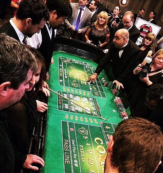 A group of people playing a game called pass line
