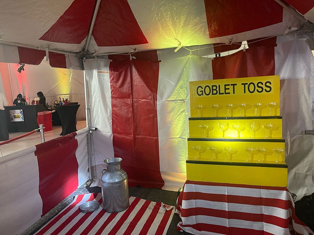 A tent with a sign that says goblet toss on it.