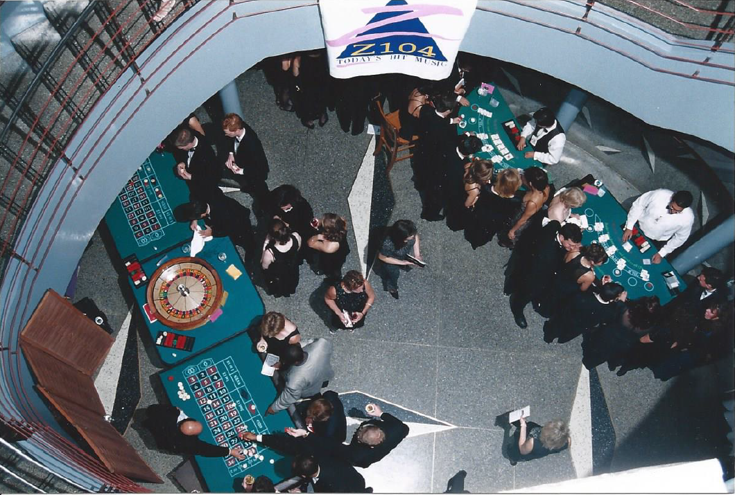 An aerial view of people playing roulette in a casino