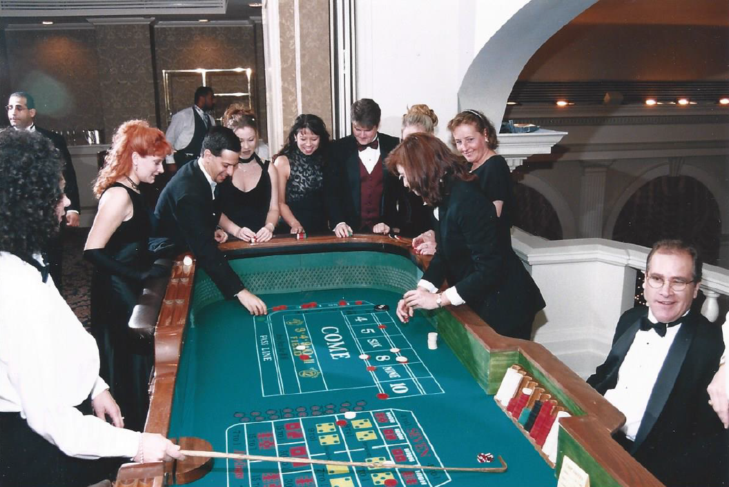 A group of people are playing roulette in a casino