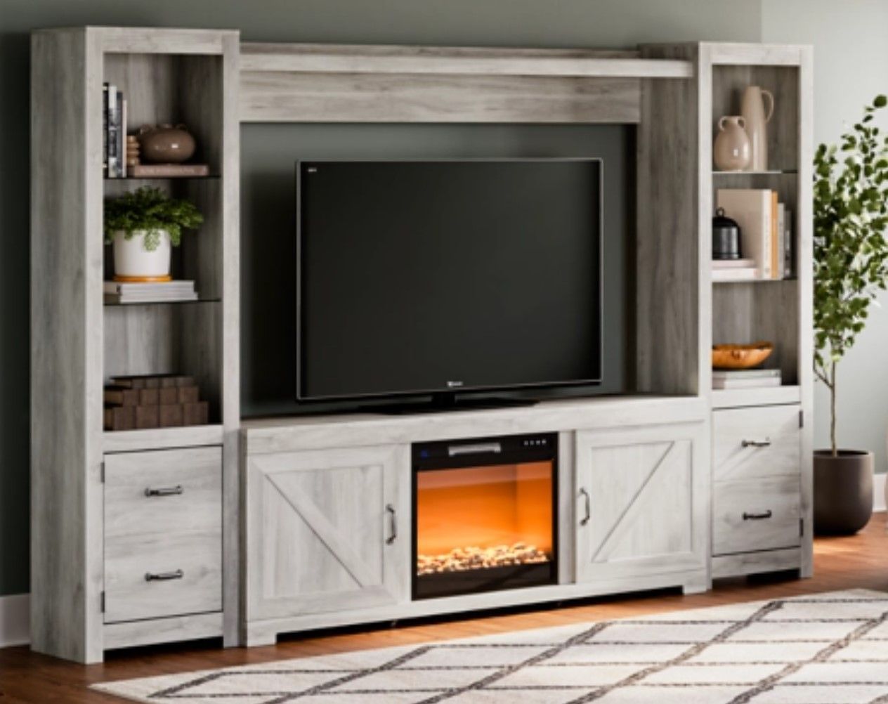 Red Bluff Interiors furniture showroom California white TV entertainment center with fireplace, shelves, and modern living room display