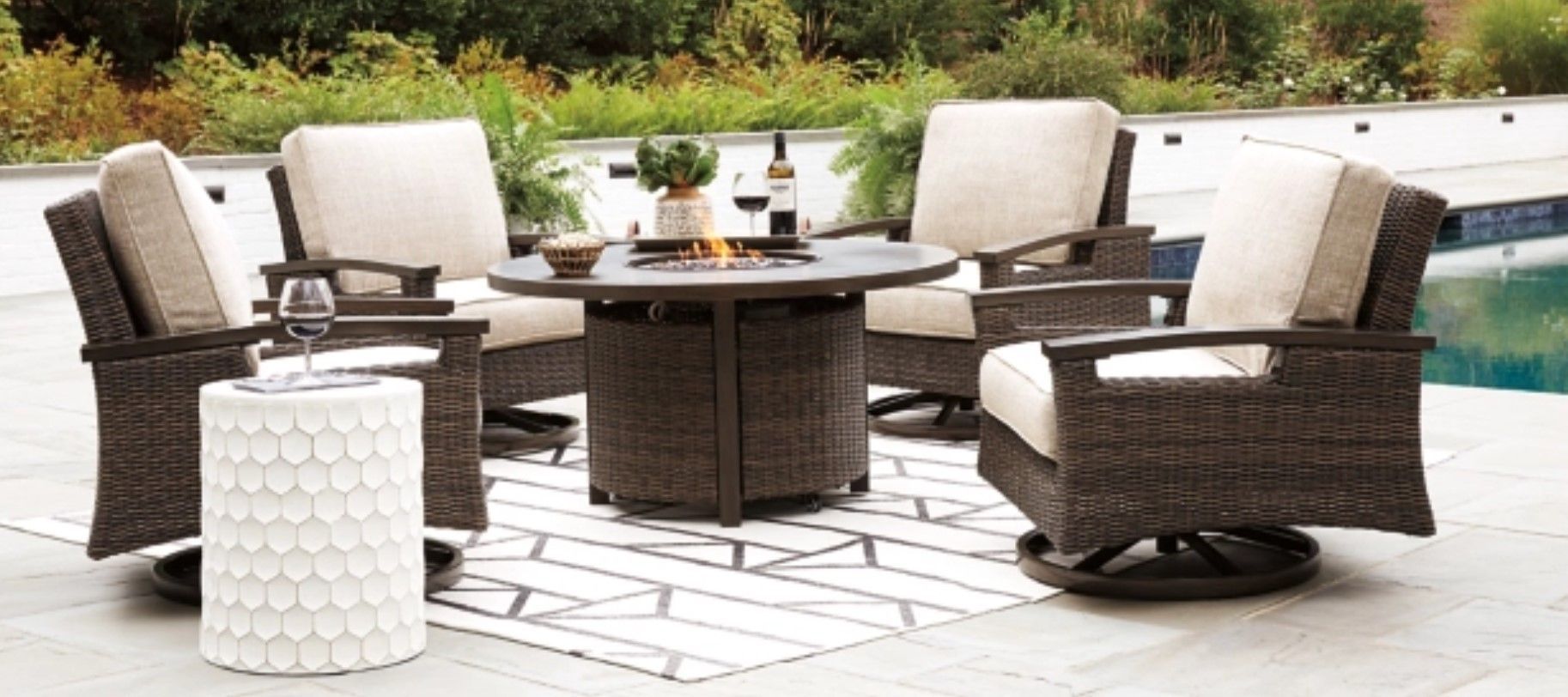Red Bluff Interiors furniture showroom California outdoor wicker seating set with fire pit and patio poolside display