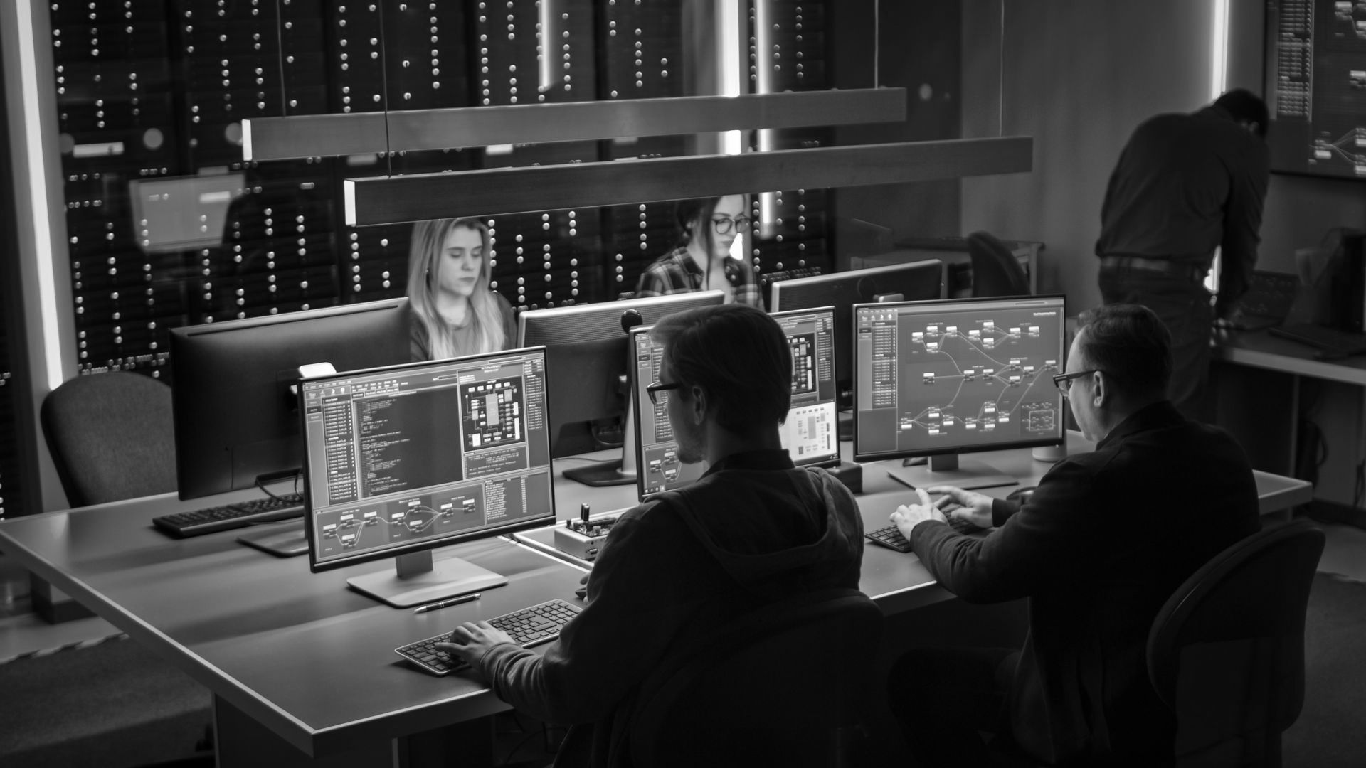 Four cyber security experts work on digital risk protection