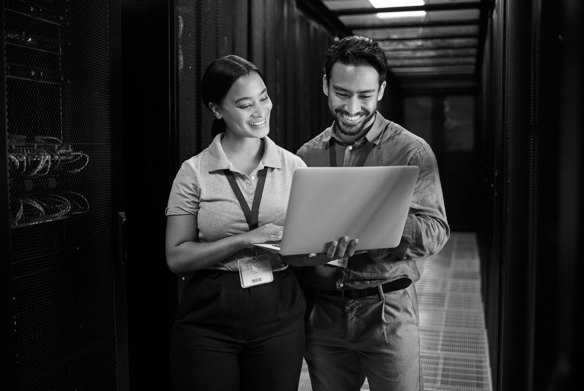 Techs smiling, satisfied that the network servers are back online