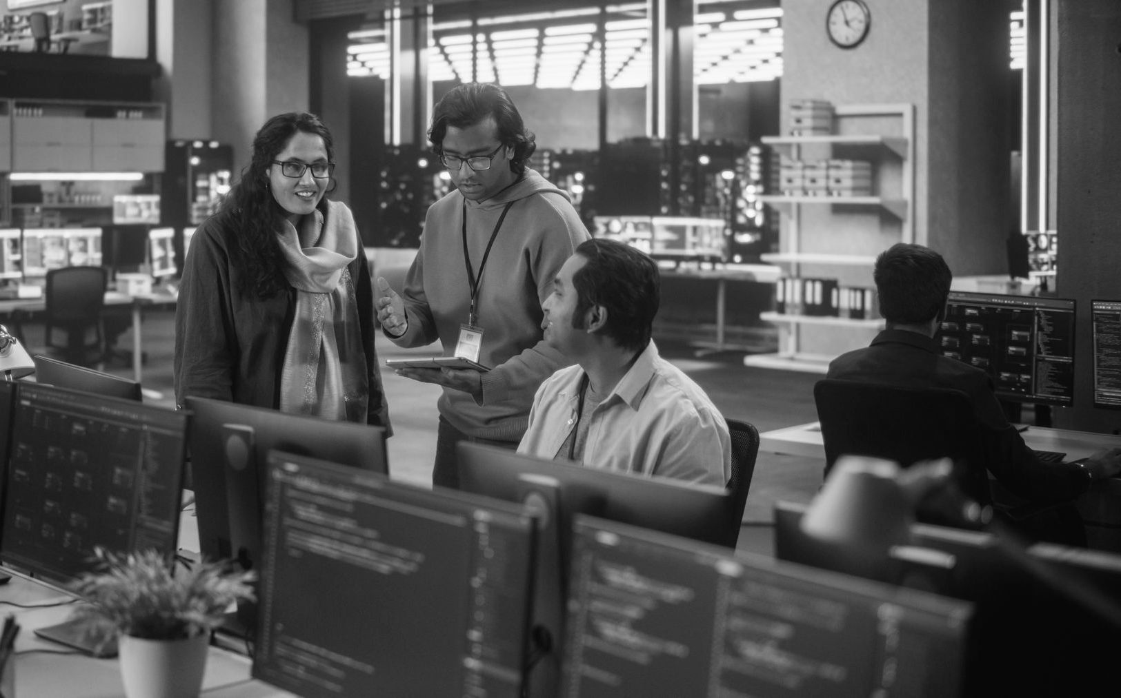 IT specialists discussing the business benefits of cloud computing