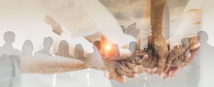 A double-exposure image showing several people holding their hands together in the center, layered over a blurred city.