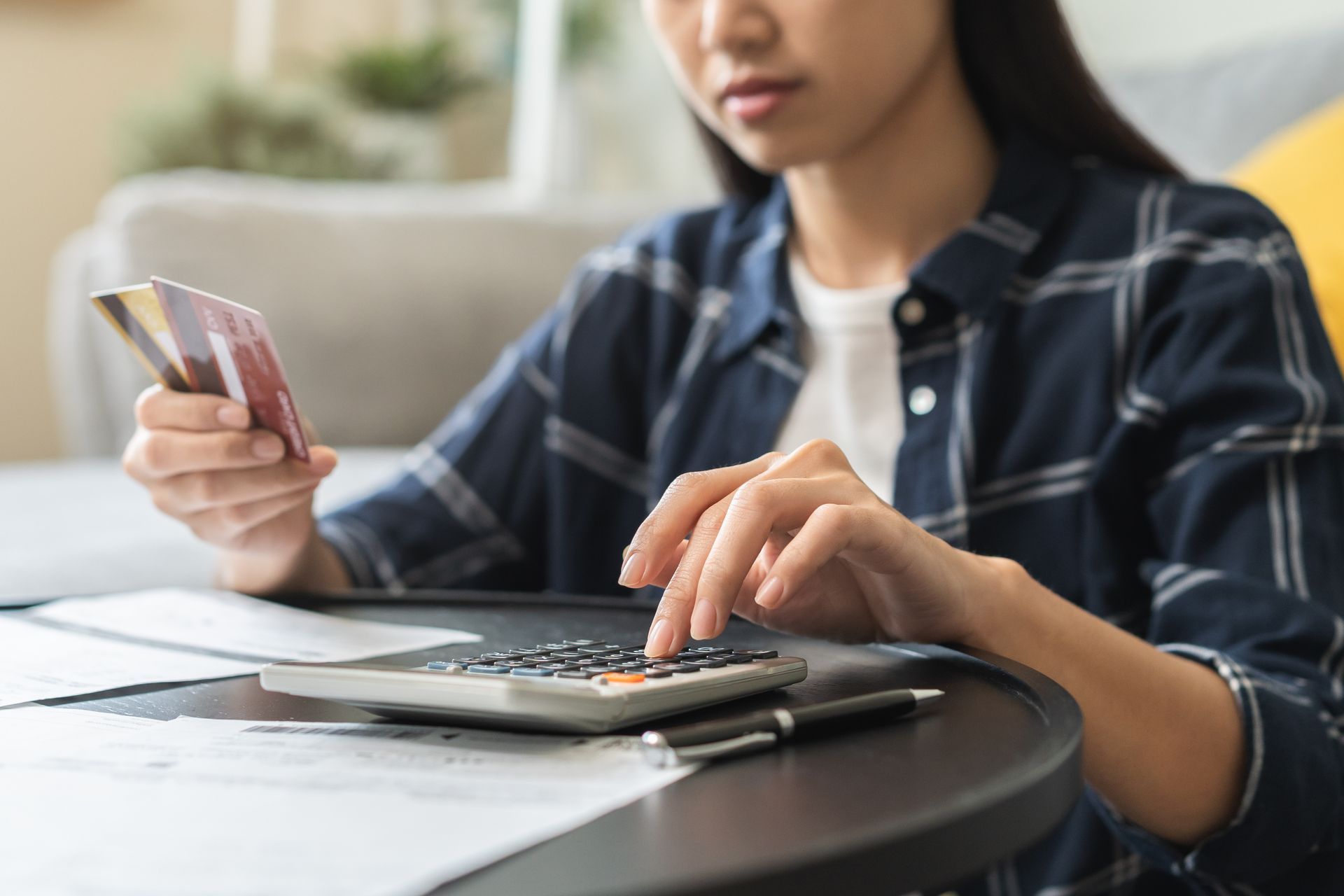 Woman with calculator and cards
