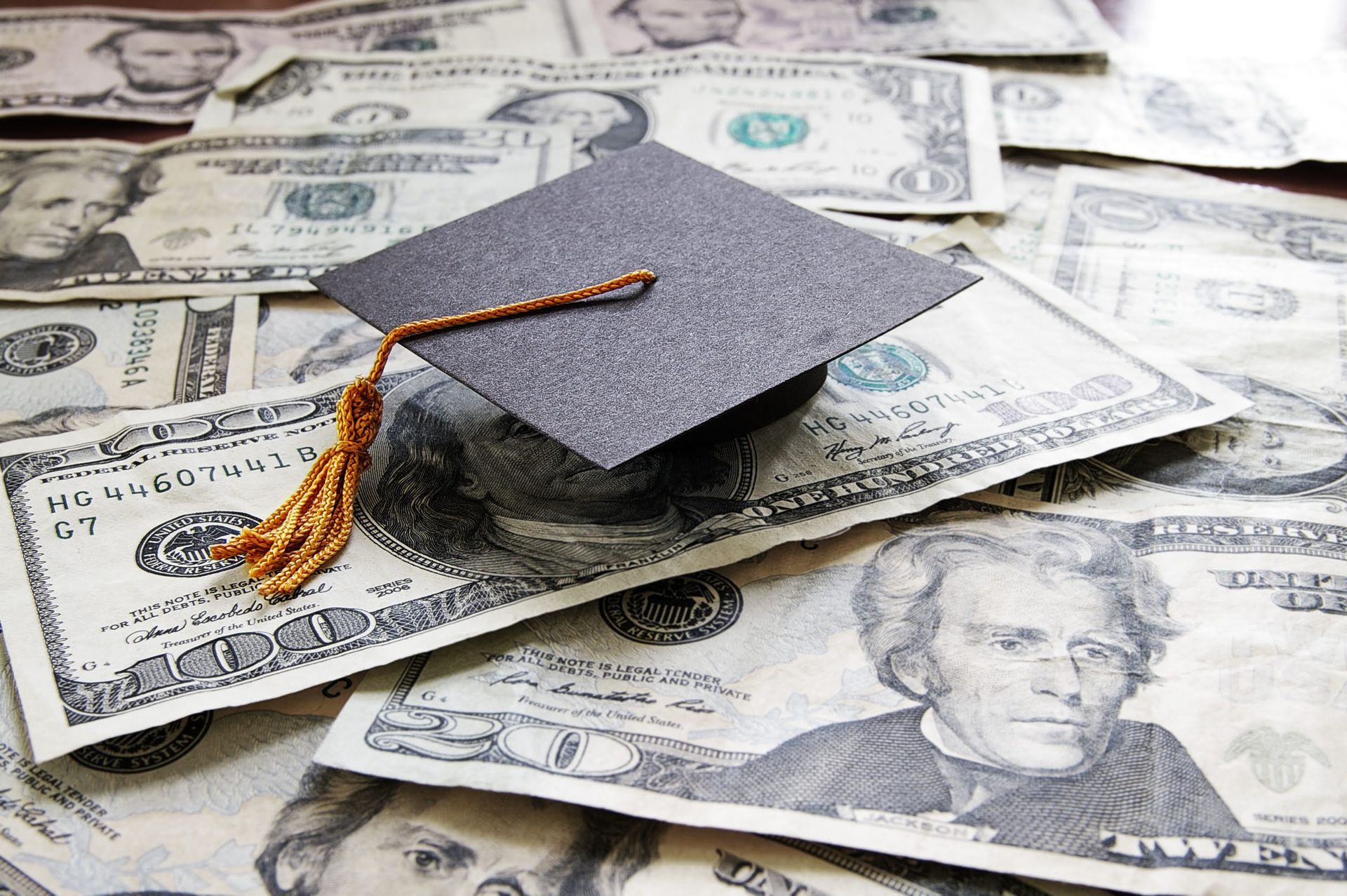 Grad cap on dollar bills
