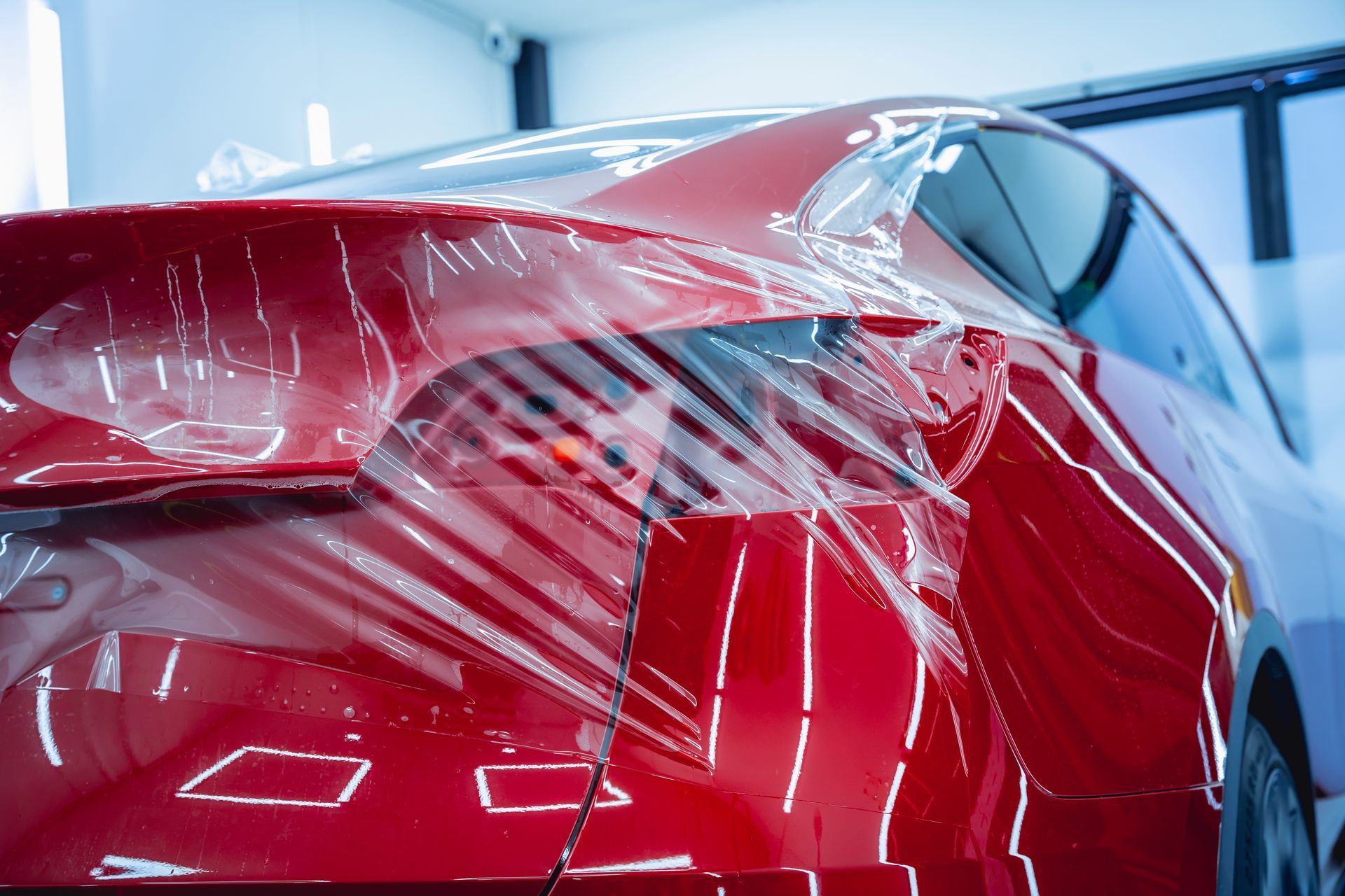 Car hood covered in clear protective film.