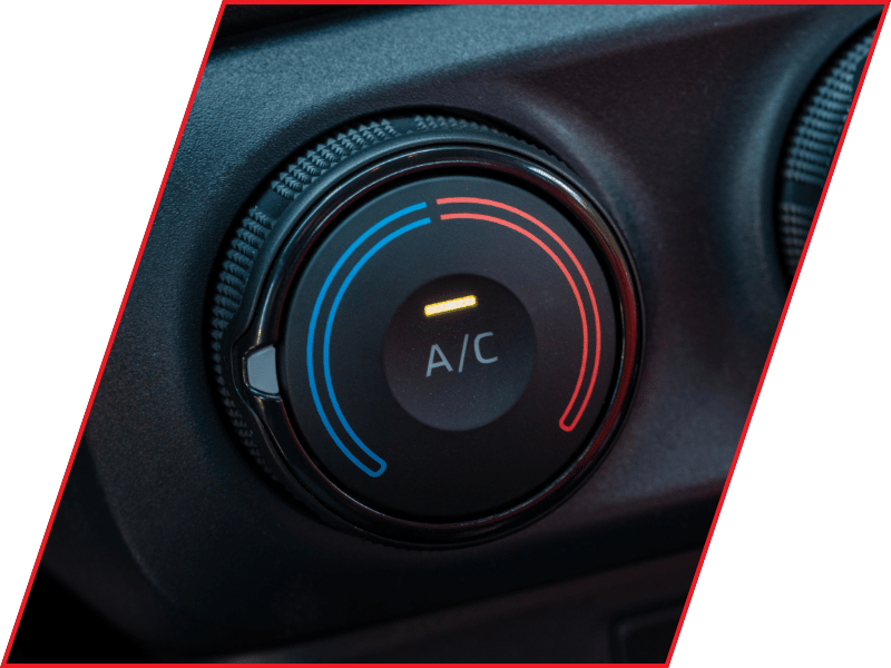 Close-up of a vehicle air conditioning temperature control dial with blue and red settings