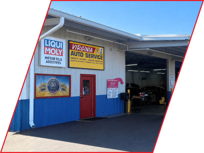 Virginia Auto Service shop exterior with LIQUI MOLY sign, red door, and open garage bay