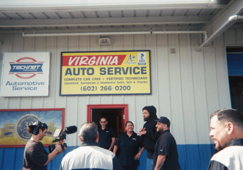 J. Cole outside Virginia Auto Service shop
