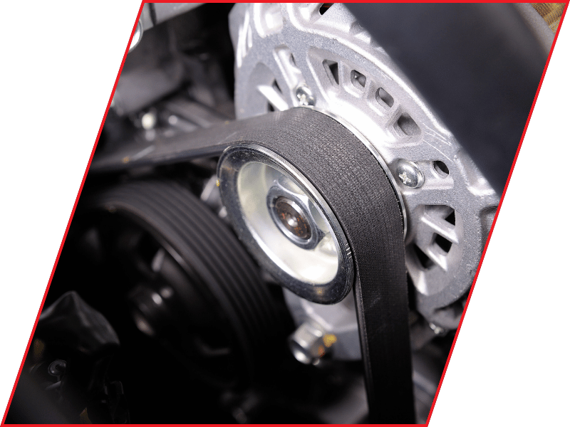 Close-up of a serpentine belt wrapped around an alternator pulley in a vehicle engine