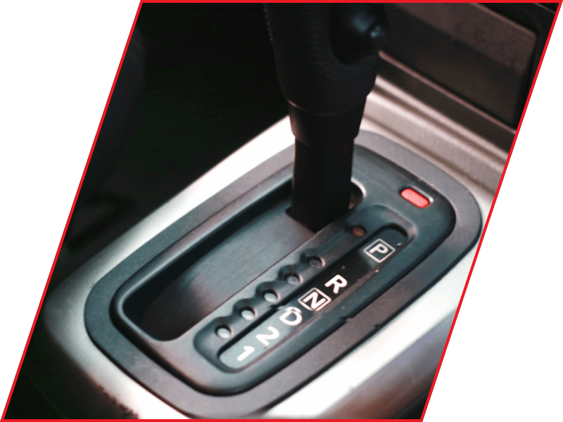 Close-up of an automatic transmission gear selector showing park, reverse, neutral, and drive