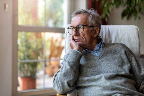 An Elderly Man Is Sitting In A Chair Looking Out A Window – Independence, MO - Mary Hargrave