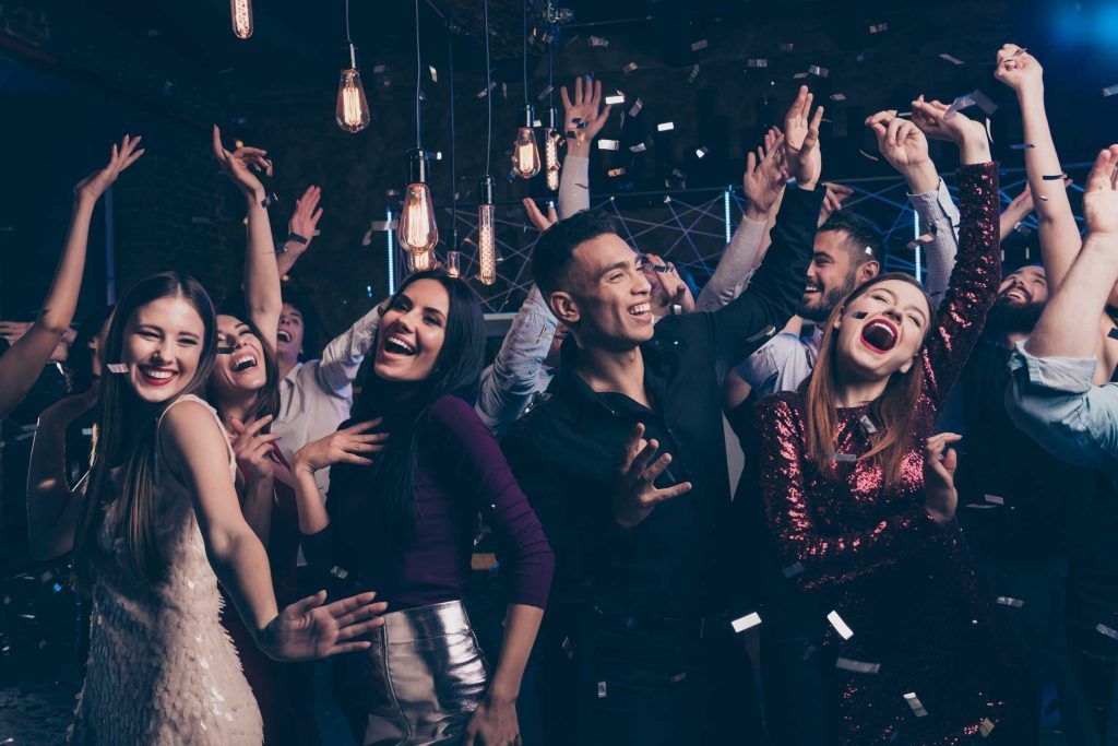 A Group Of People Are Dancing At A Party With Their Hands In The Air – Independence, MO - Mary Hargrave
