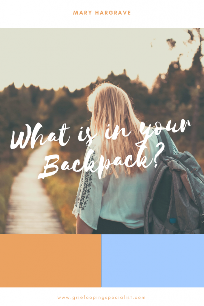 A Woman Is Walking Down A Path With A Backpack – Independence, MO - Mary Hargrave