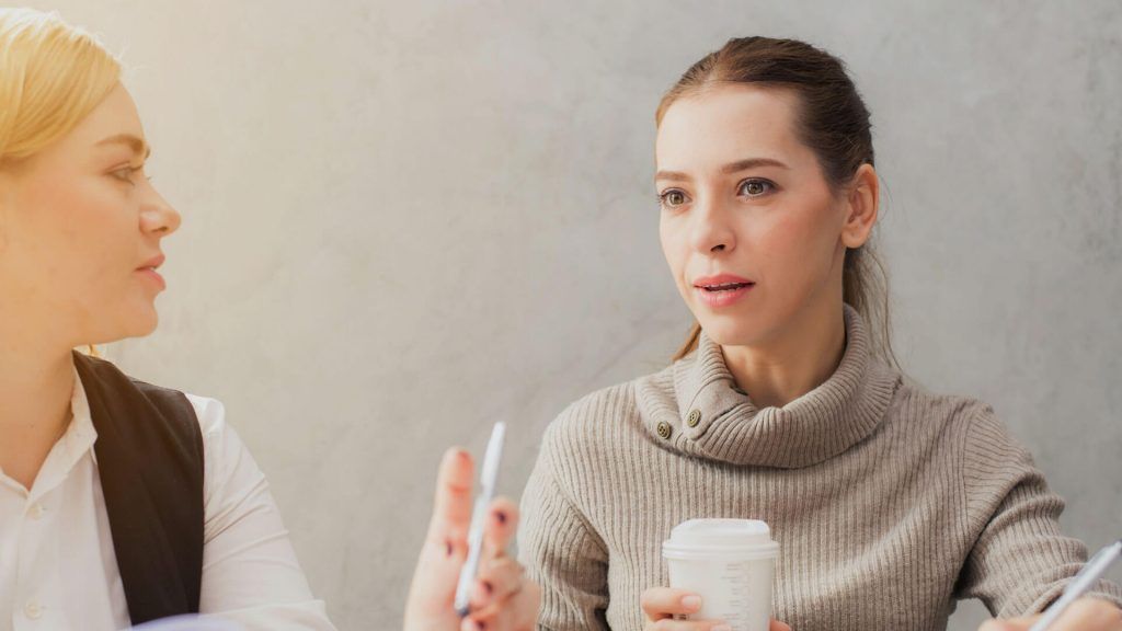 Two Women Are Sitting At A Table Drinking Coffee And Talking To Each Other – Independence, MO - Mary Hargrave