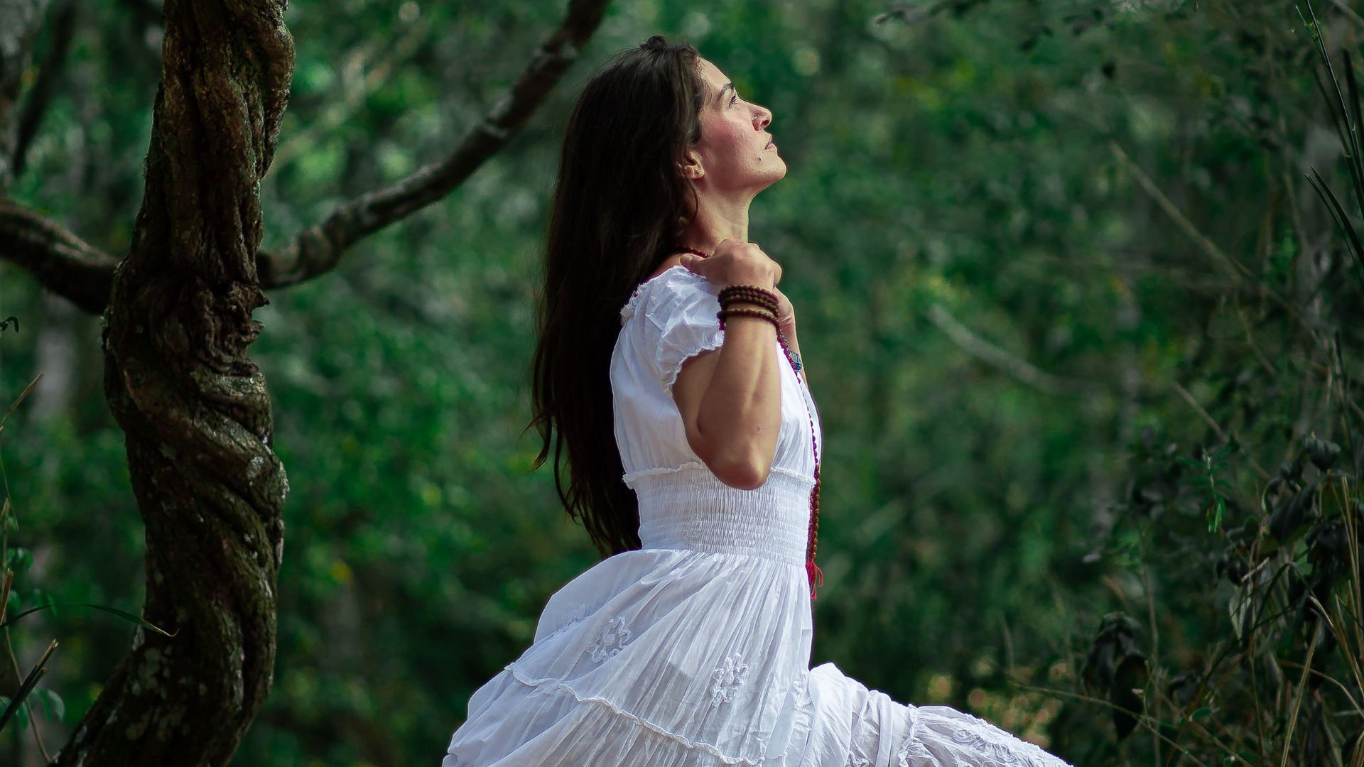 woman sitting and relaxing in the forrest