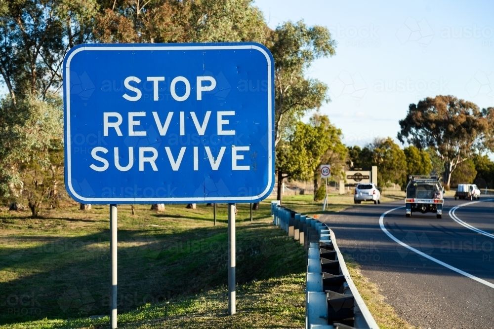 stop revive survive highway sign