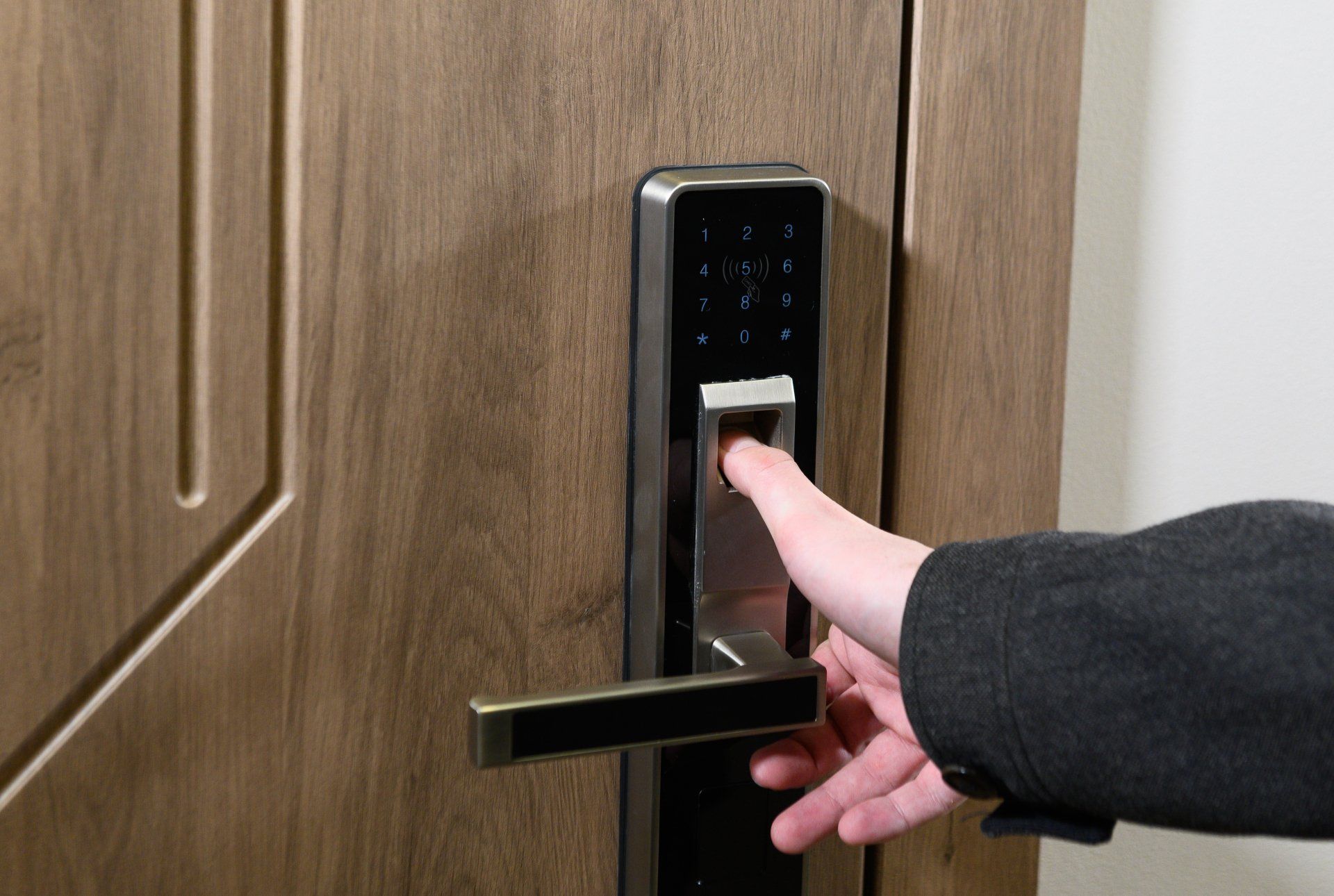 Yong man or woman push fingers down the electronic control machine to access the door