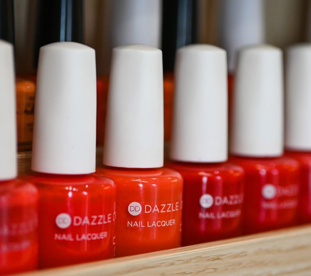 Bottles of dazzle nail lacquer are lined up in a row
