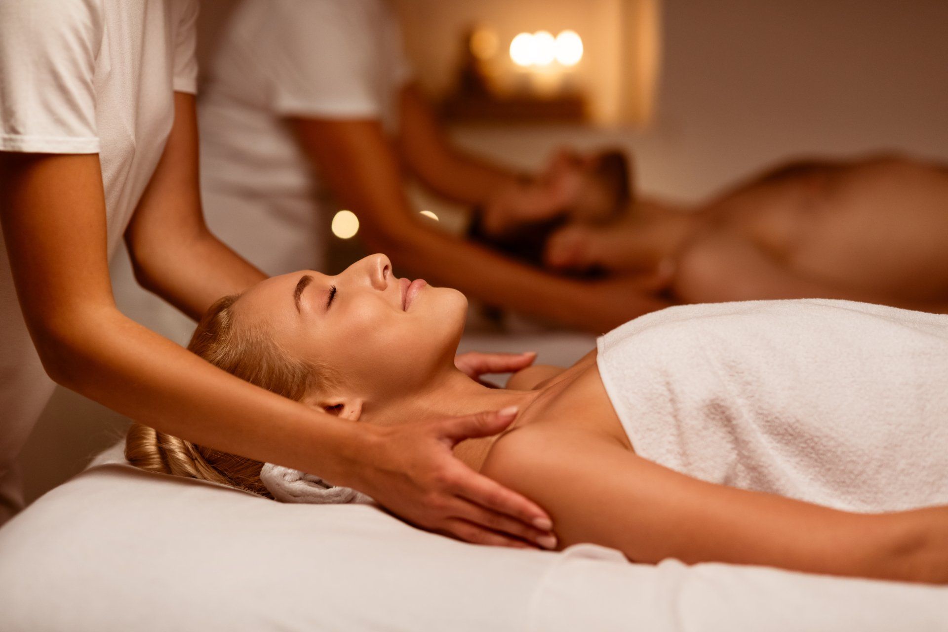 A woman is getting a massage in a spa.