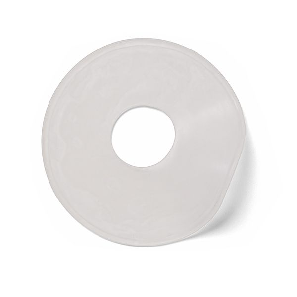 A white plastic washer with a hole in the middle on a white background.