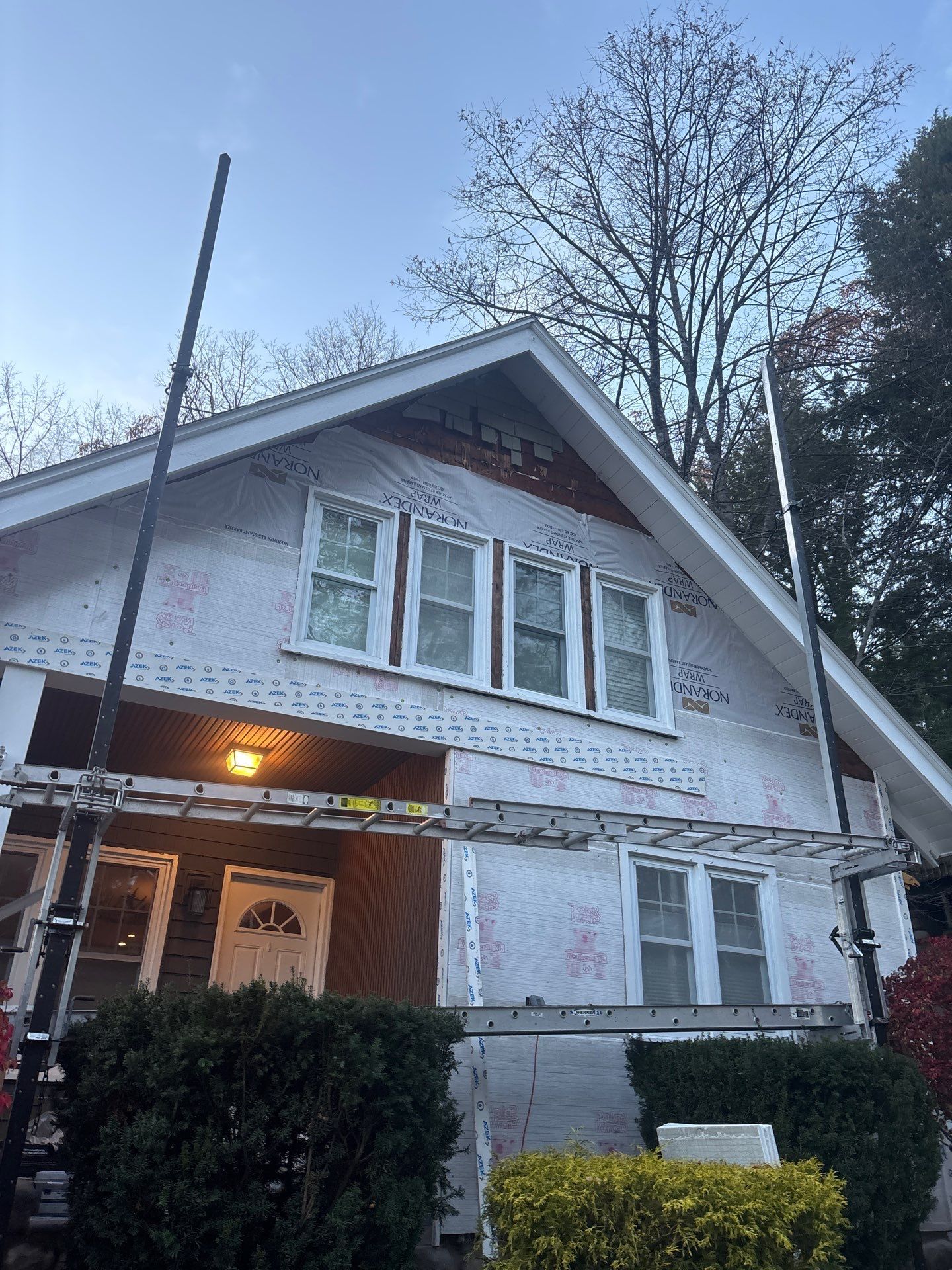 Before siding exterior project by United Roofing and Siding at 10 N Brook Dr. Bolton Landing, NY