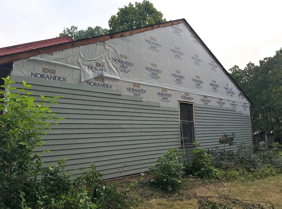 Before siding exterior project at 517 Townwood Dr. Albany, NY
