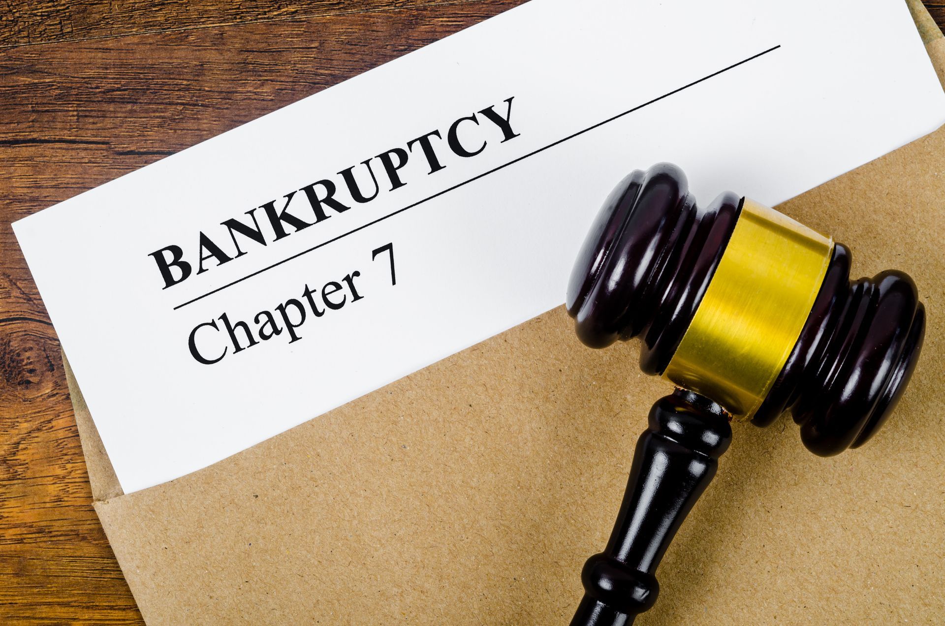 Bankruptcy documents with a wooden gavel, symbolizing legal and business concepts.
